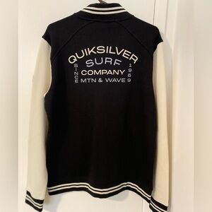 Quiksilver zip up sweater. Black with off white sleeves. NEW with tags